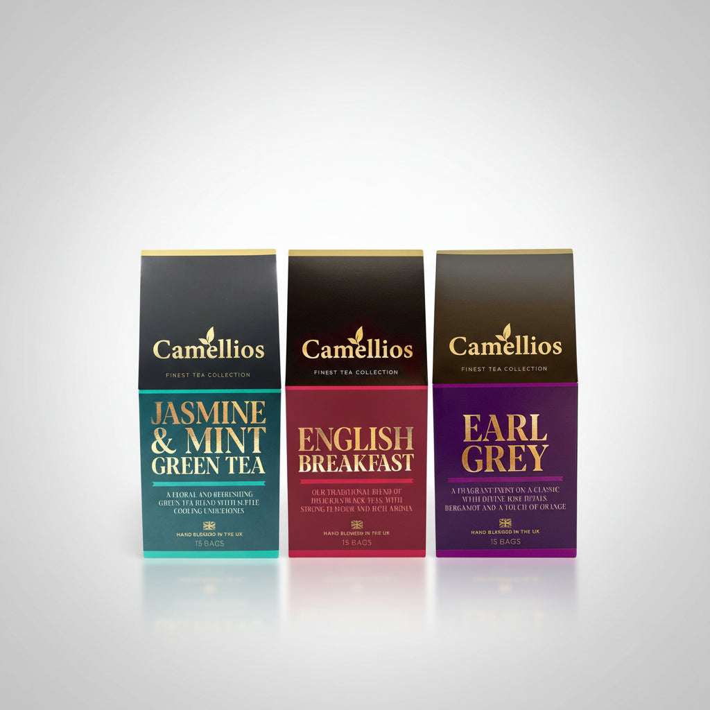 Three Camellios tea packages with different flavors on a white background